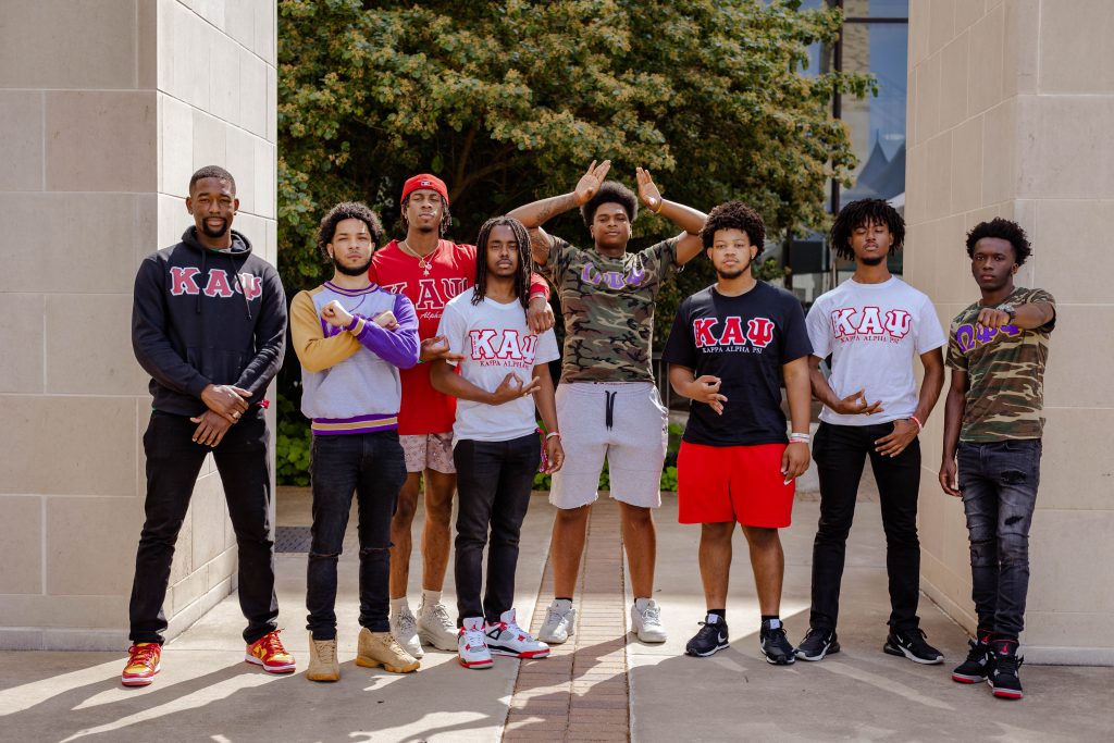 Members of NPHC fraternities standing by the Liberal Arts & Humanities Building